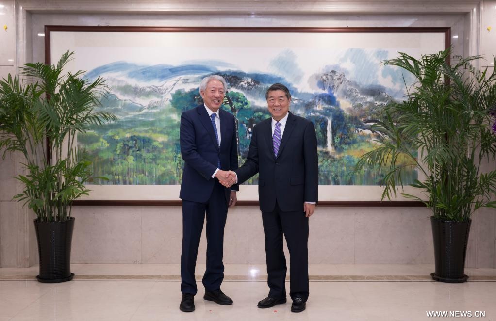 مسؤول صيني رفيع المستوى يلتقي برئيس شركة "تيماسيك" السنغافورية
